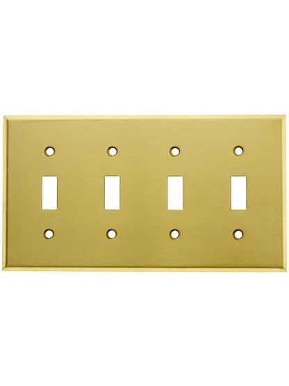 Classic Four Gang Toggle Switch Plate In Satin Brass.